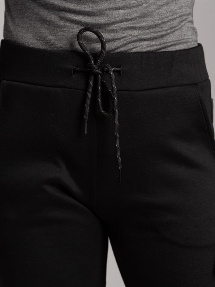 Jogger TECNO de mujer en tejido bicolor con cremalleras invisibles
