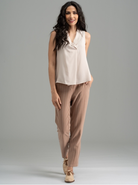 Camisa de mujer sin mangas de color liso con reverso