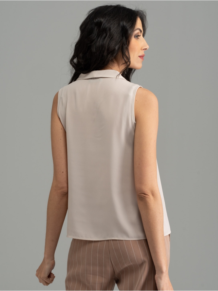 Camisa de mujer sin mangas de color liso con reverso