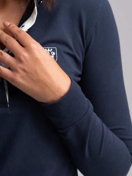 Polo de mujer de manga larga con puntales y volante