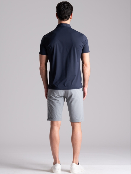 Polo azul TECNO de media manga para hombre con cuello camisero