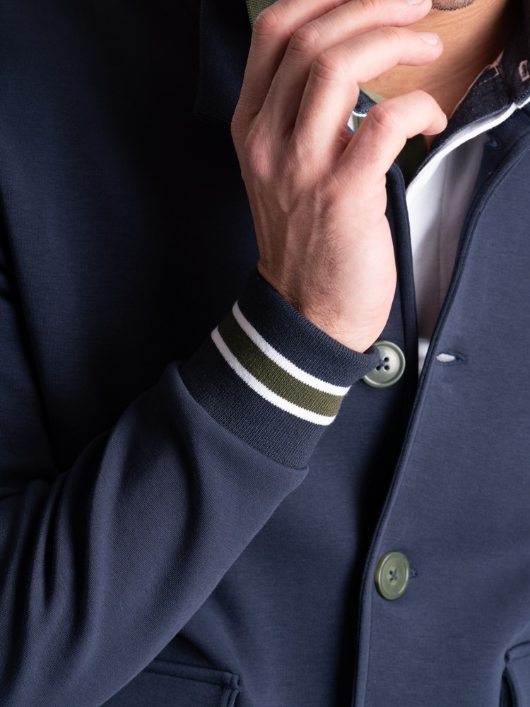 Cazadora bomber de punto para hombre con botonadura y bolsillos